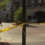 Crime scene tape and  evidence markers at Midtown 360 apartments. (KSL TV) 