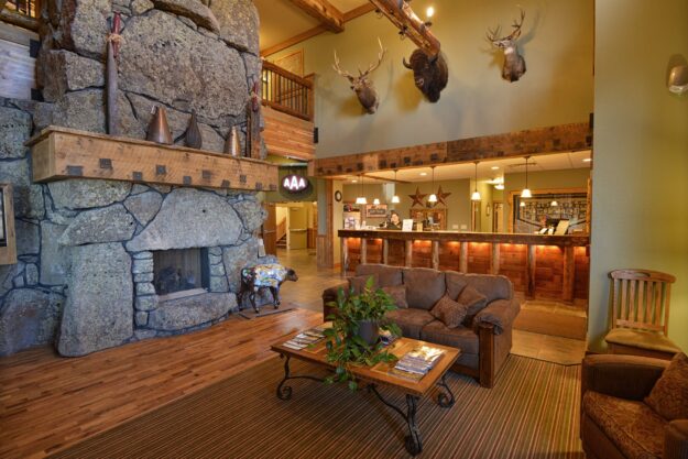 The interior of the Three Bear Lodge fireplace and front desk 