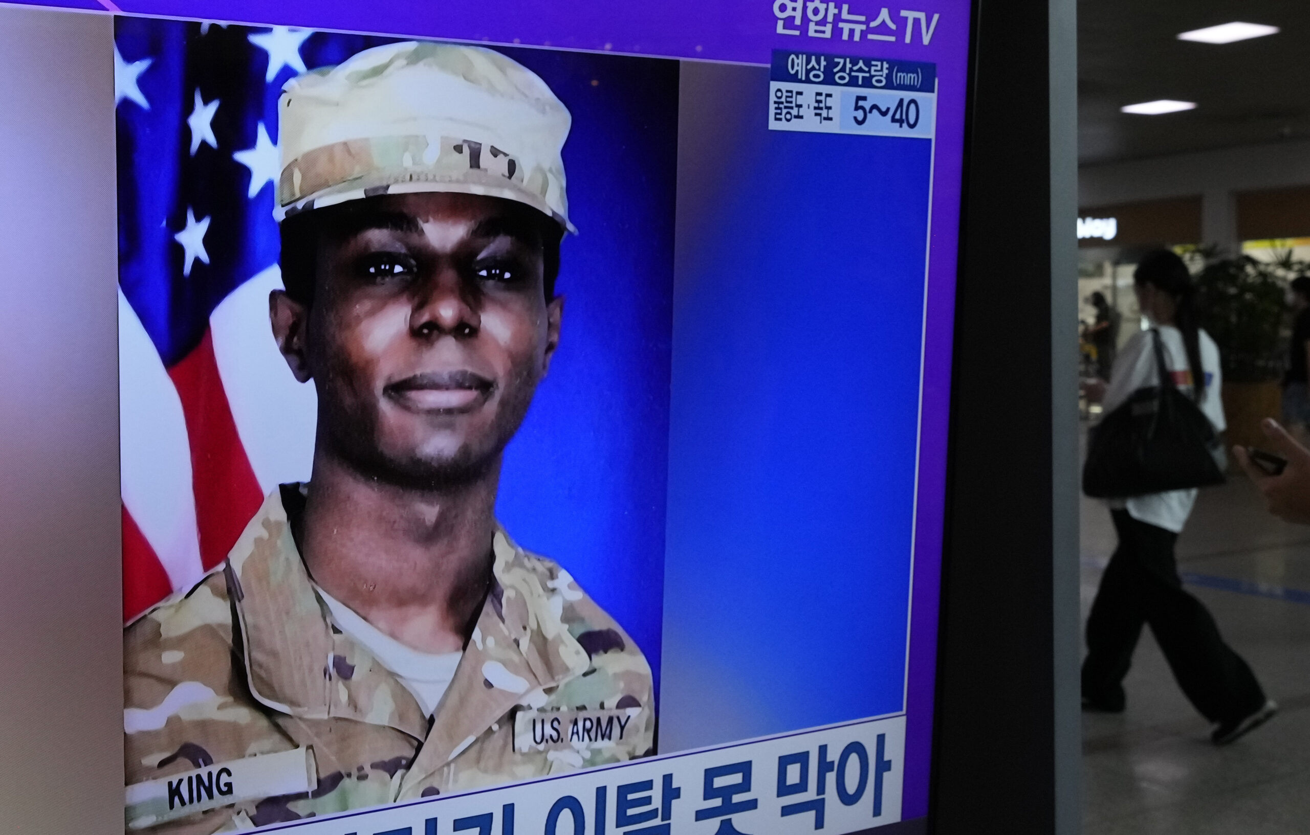 A TV screen shows a file image of American soldier Travis King during a news program at the Seoul R...