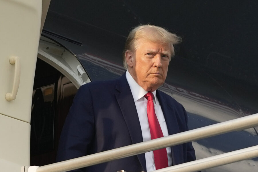 Former President Donald Trump steps off his plane as he arrives at Hartsfield-Jackson Atlanta Inter...