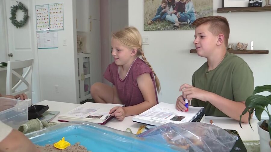 Lucy and Dean Hess homeschooling with their mother and 3-year-old younger sister. (KSL TV)...