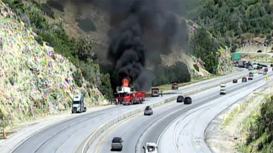 Smoke and fire on vehicle to the side of I-80...