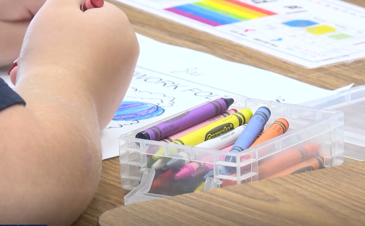 A student colors with crayons in a Cache County classroom...