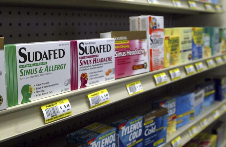 Sudafed and other common nasal decongestants containing pseudoephedrine are on display behind the c...