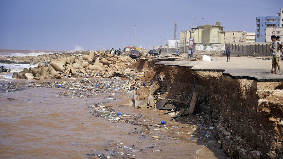 In this photo provided by the Libyan government, a seaside road is collapsed after heavy flooding i...