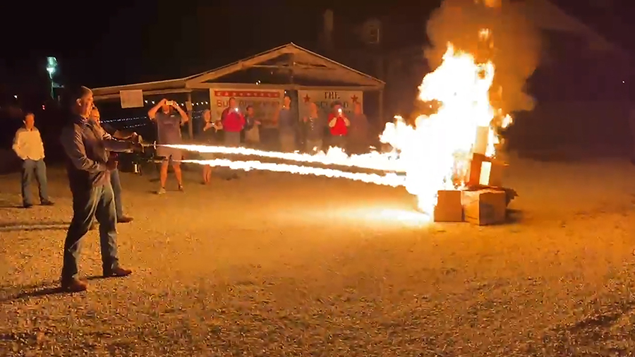 In this frame grab from video provided by Debbie McFarland, state Sen. Bill Eigel torches a pile of...