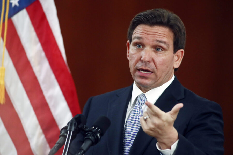 FILE - Florida Gov. Ron DeSantis answers questions from the media in the Florida Cabinet following ...