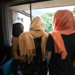 Two Afghani sisters, ages 32 and 17, stand with their 6 year-old niece at their apartment in Salt Lake City on Thursday, July 27, 2023. Their identities are not shown to protect them from the Taliban. (Jeffrey D. Allred, Deseret News)