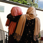 Two Afghani sisters, ages 32 and 17, hug at their apartment in Salt Lake City on Thursday, July 27, 2023. Their identities are not shown to protect them from the Taliban. (Jeffrey D. Allred, Deseret News)