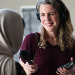 KSL’s Andrea Smardon, podcast producer, interviews an Afghani woman near her apartment in Salt Lake City on Thursday, July 27, 2023. Her identity are not shown to protect her from the Taliban.