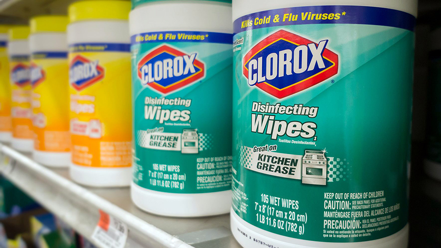 canisters of clorox wipes sit on a shelf...