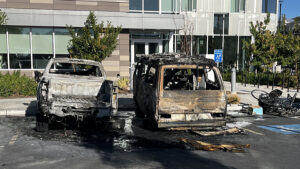 a burned out truck and van