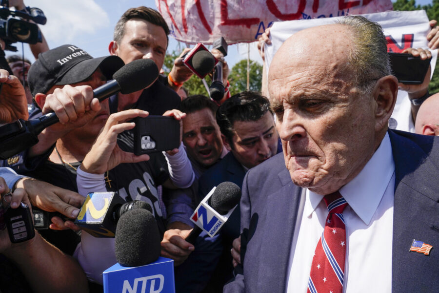 FILE - Rudy Giuliani speaks outside the Fulton County jail, Wednesday, Aug. 23, 2023, in Atlanta. G...