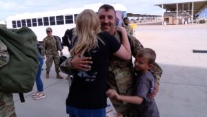 Dale Schoolcraft reuniting with his family at the base