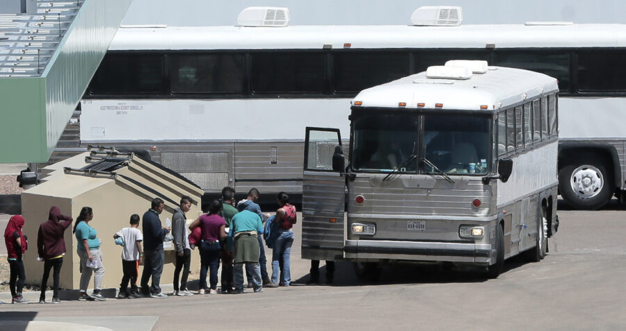 FILE - In this April 20, 2019 file photo, migrants are loaded onto a bus at the Border Patrol headq...