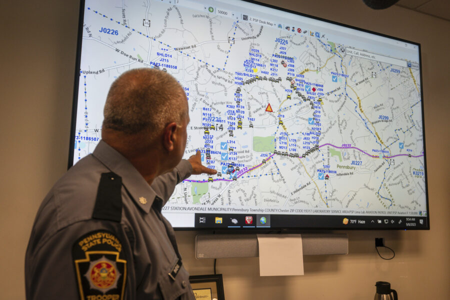 Lt. Col George Vivens shows th map of the area delineated by law enforcement and their vehicles, du...