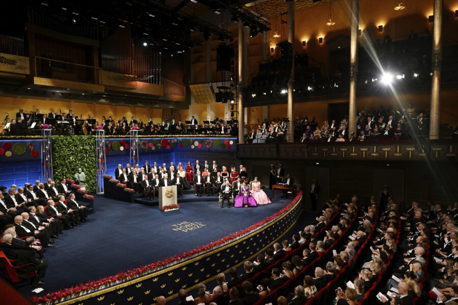 FILE - The Nobel laureates and the royal family of Sweden during the Nobel Prize award ceremony at ...