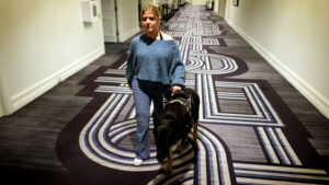 Woman and a dog in a hallway