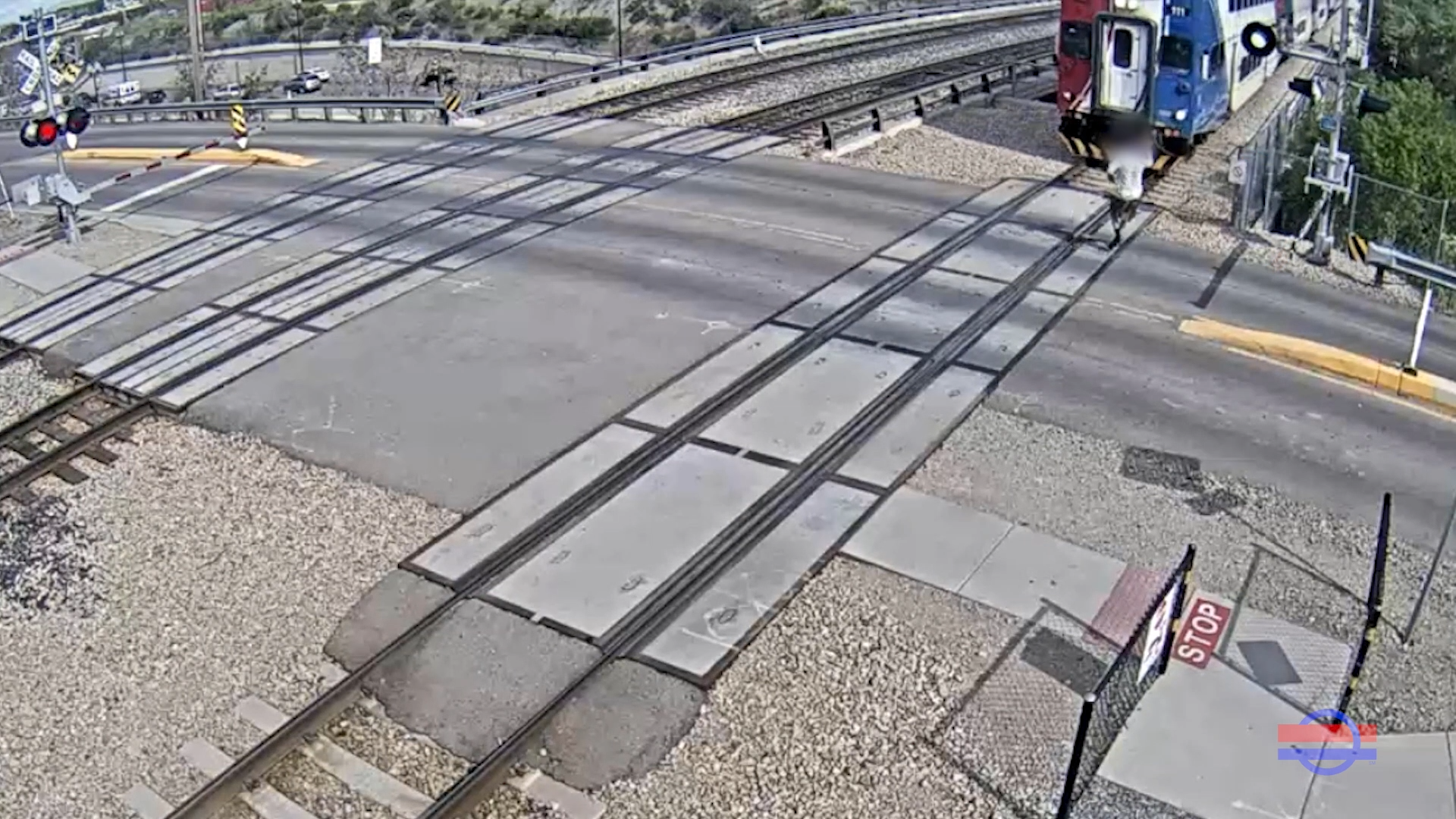 Security video showing a bystander walking across UTA trax lines and almost getting hit...