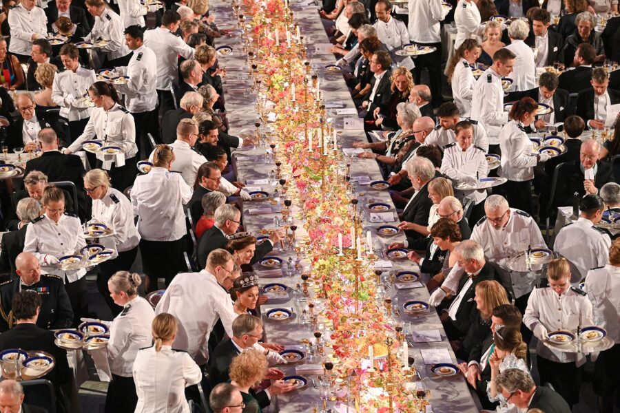 Waiters serve dessert during the Nobel Prize banquet on December 10, 2022. Russia and Belarus were ...