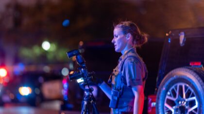 An investigator snapping photos of the shooting in Downtown Salt Lake City on early morning Sunday 9/3. (SLPD)