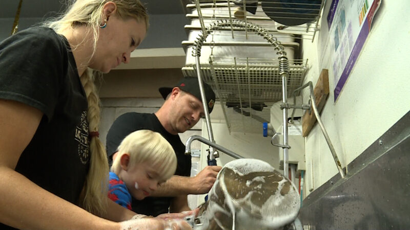 Robert and Kristal Thompson washing the dishes at their resort kitchen. (Mark Wetzel/KSL TV) 
