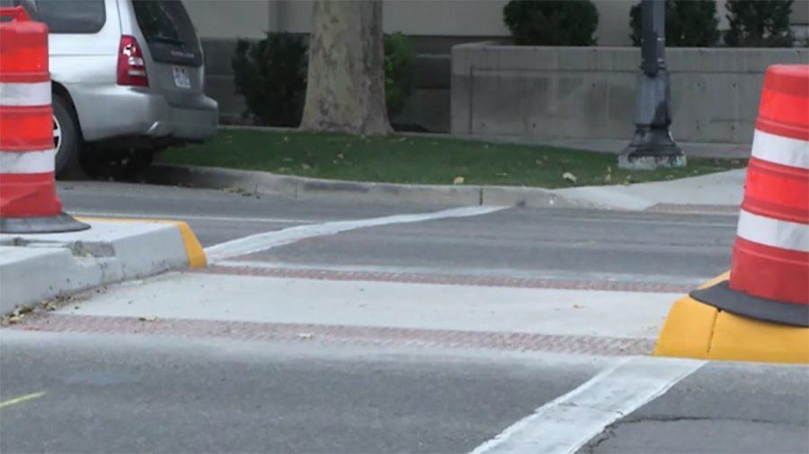 The city recently installed a concrete bulb-out and a pedestrian refuge island on Fourth West to ma...
