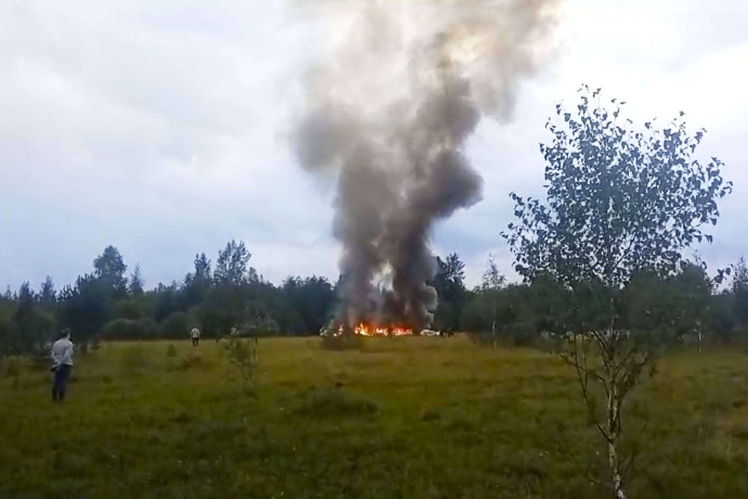 FILE - In this image taken from video, smoke rises from the crash of a private jet near the village...