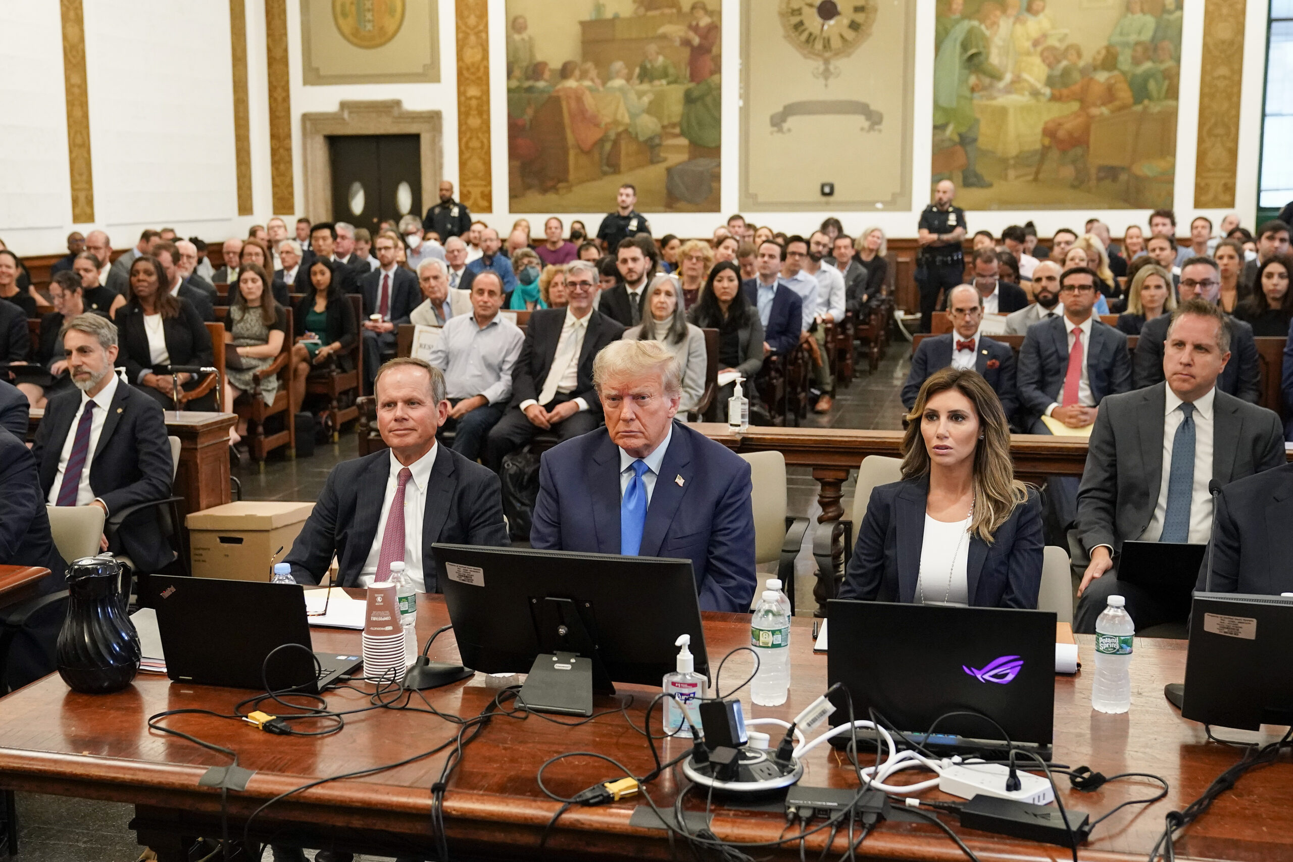 Former President Donald Trump, center, sits in the courtroom at New York Supreme Court, Monday, Oct...