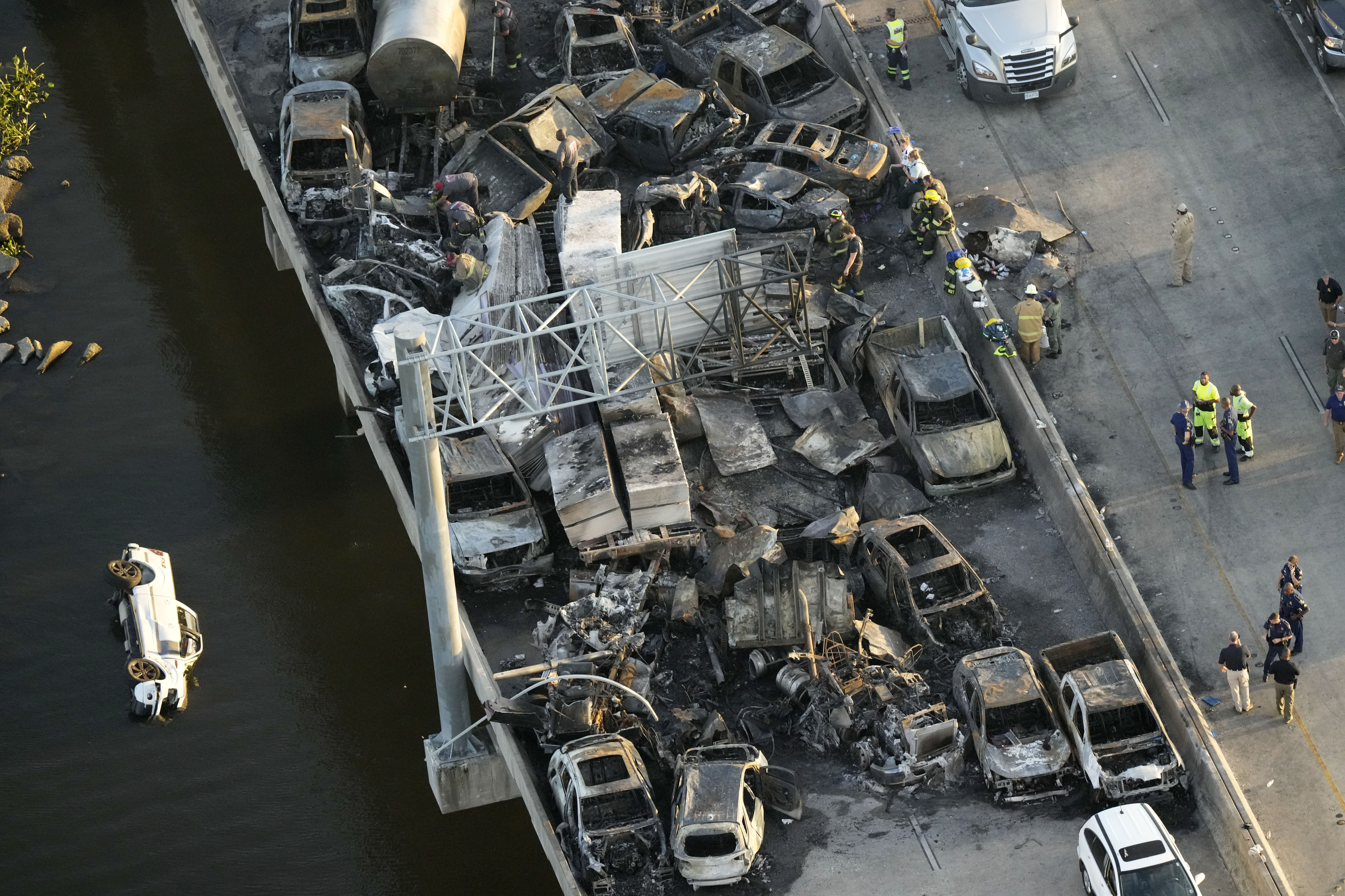 In this aerial photo, responders are seen near wreckage in the aftermath of a multi-vehicle pileup ...
