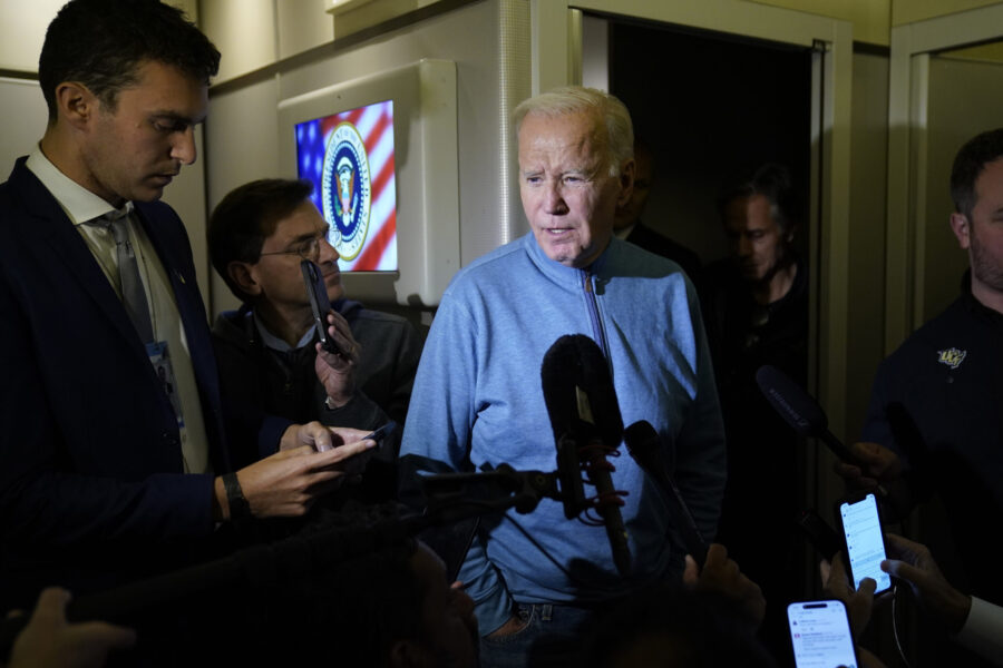 President Joe Biden talks to reporters aboard Air Force One during a refueling stop in at Ramstein ...