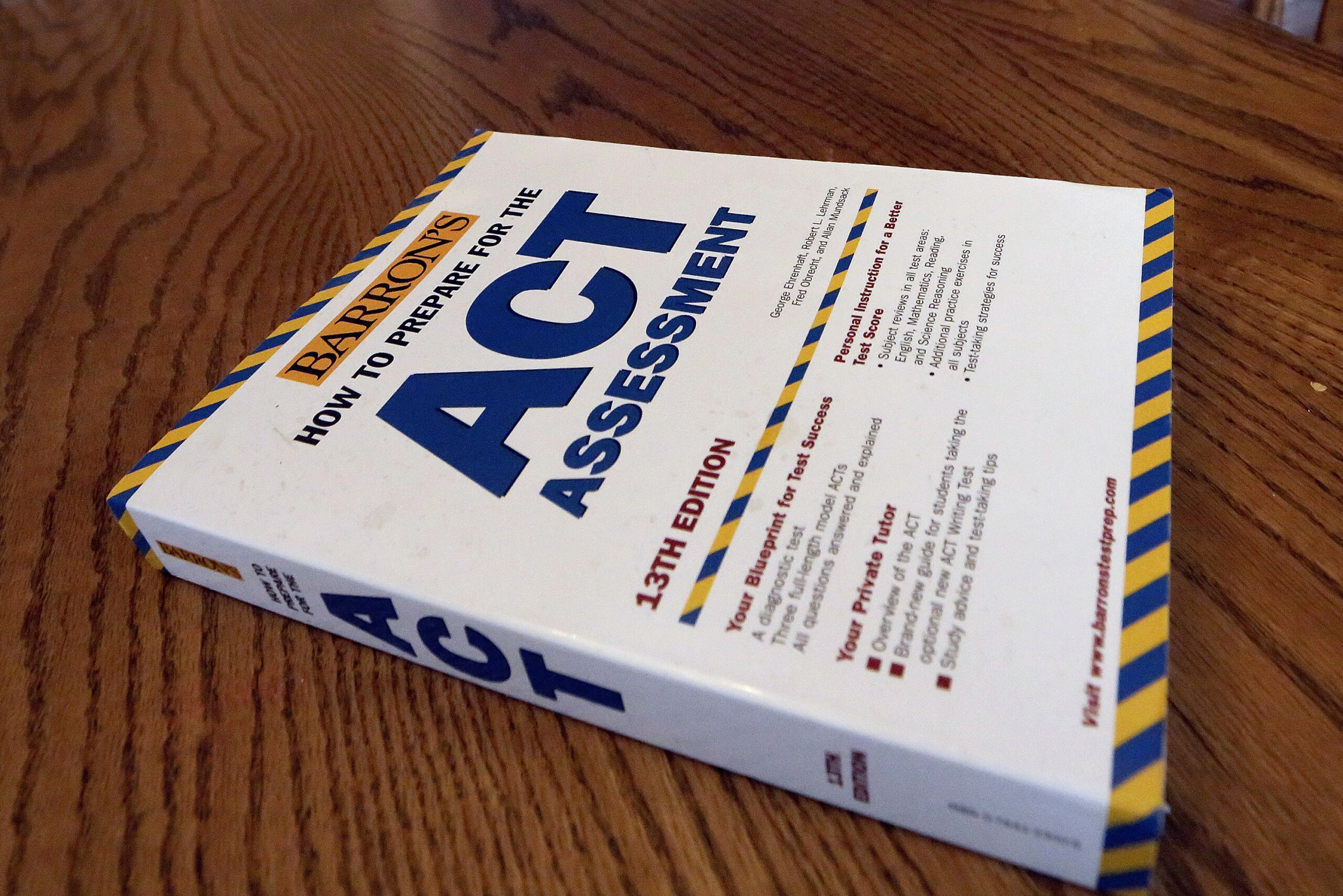 FILE - An ACT Assessment preparation book is seen, April 1, 2014, in Springfield, Ill. High school ...