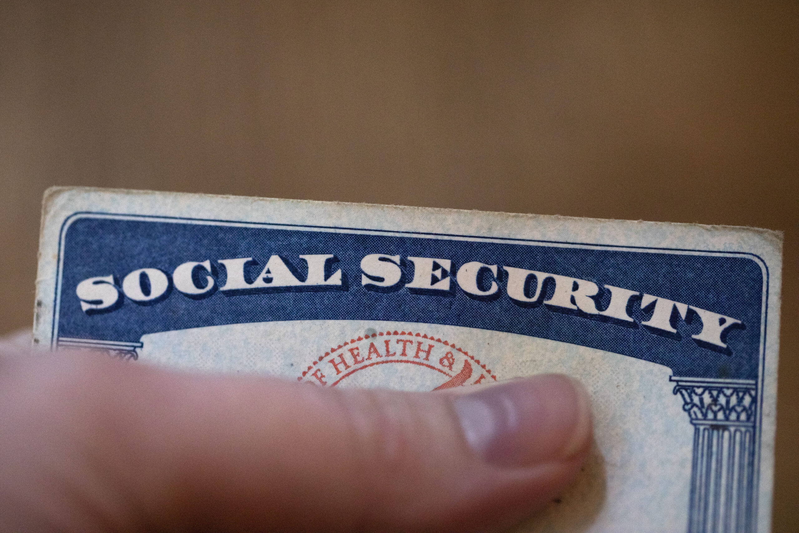 FILE - A Social Security card is displayed on Oct. 12, 2021, in Tigard, Ore. About 71 million peopl...