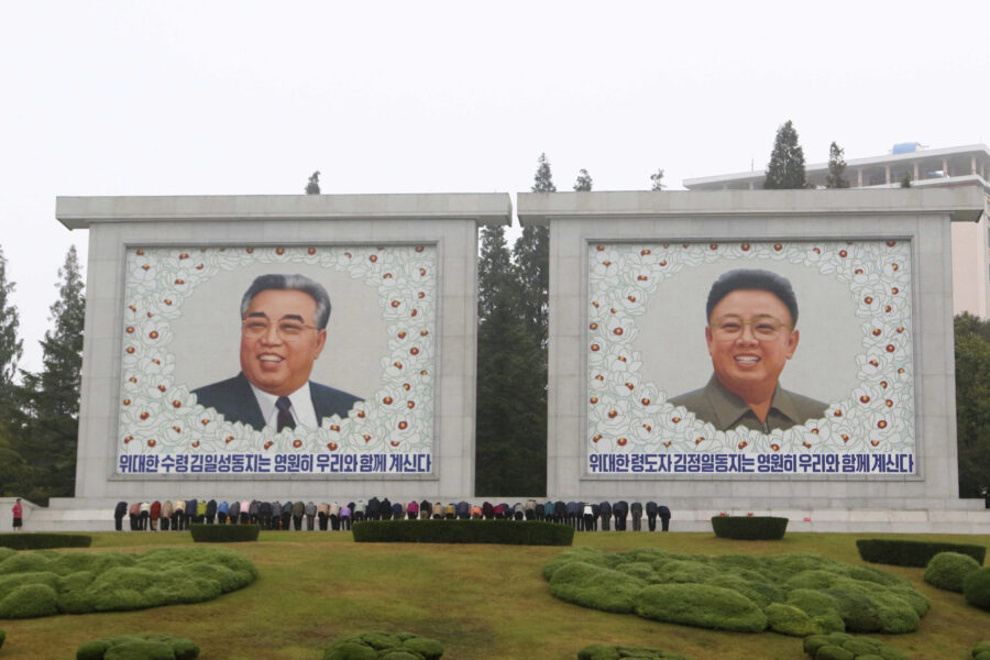 FILE - Citizens visit the portraits of the country's late leaders Kim Il Sung and Kim Jong Il on th...