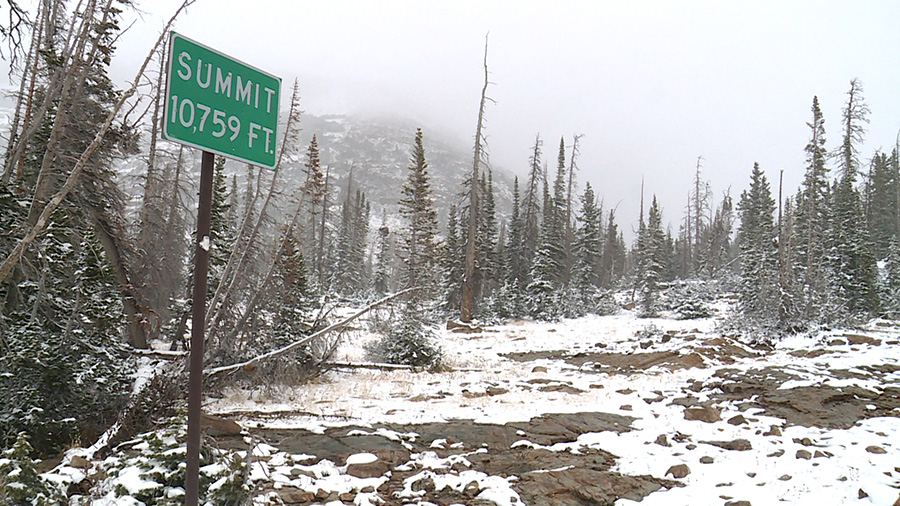Elevation 10,759 feet sign in snow...