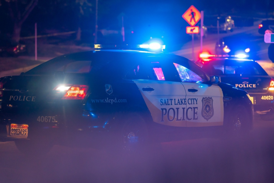 A Salt Lake City police car blocks traffic near 1100 East 900 South following a deadly pursuit (SLC...