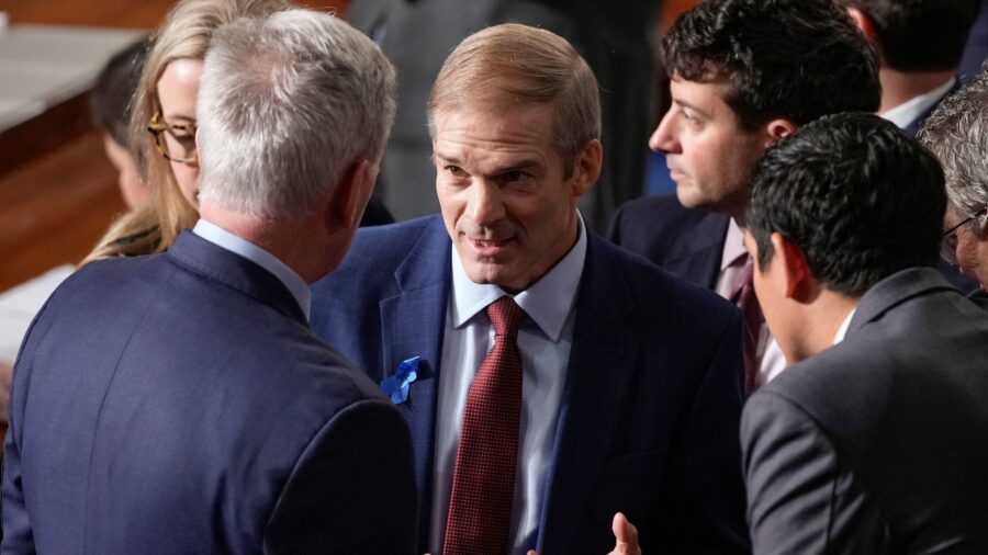 Rep. Jim Jordan talks with Rep. Kevin McCarthy and others at the Capitol in Washington on October 1...