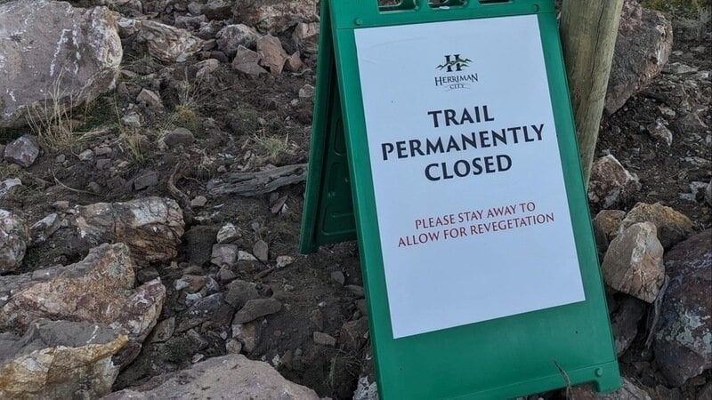 Herriman City's signage indicates the permanent closure of Eric's Trail. Drea Dettmers, change.org)...