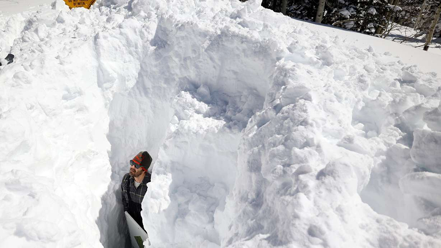Dave Eiriksson stands in snow pit....