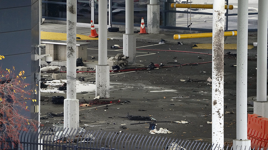 Debris scattered around poles in customs plaza...
