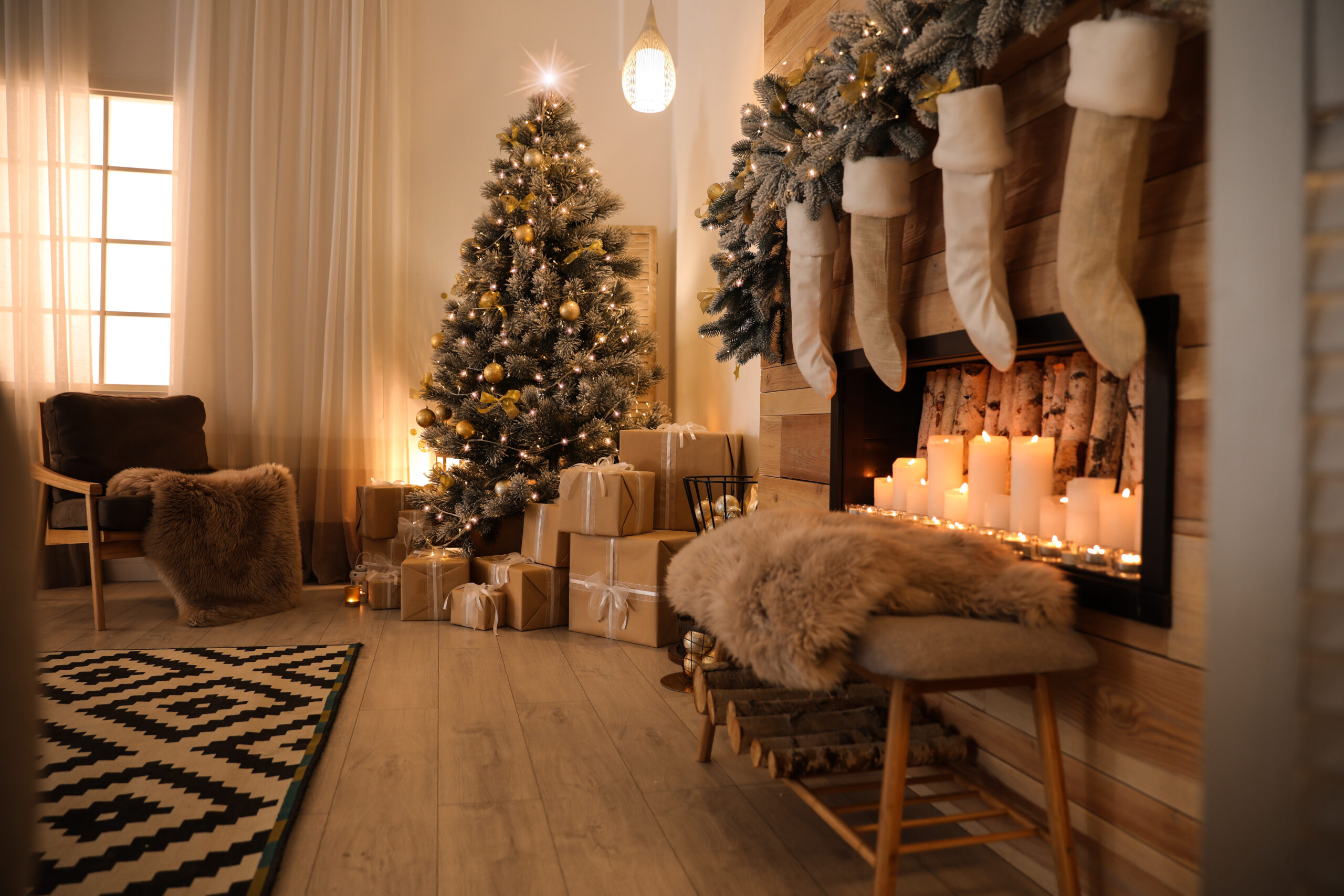 Stylish room interior with beautiful Christmas tree and decorative fireplace...