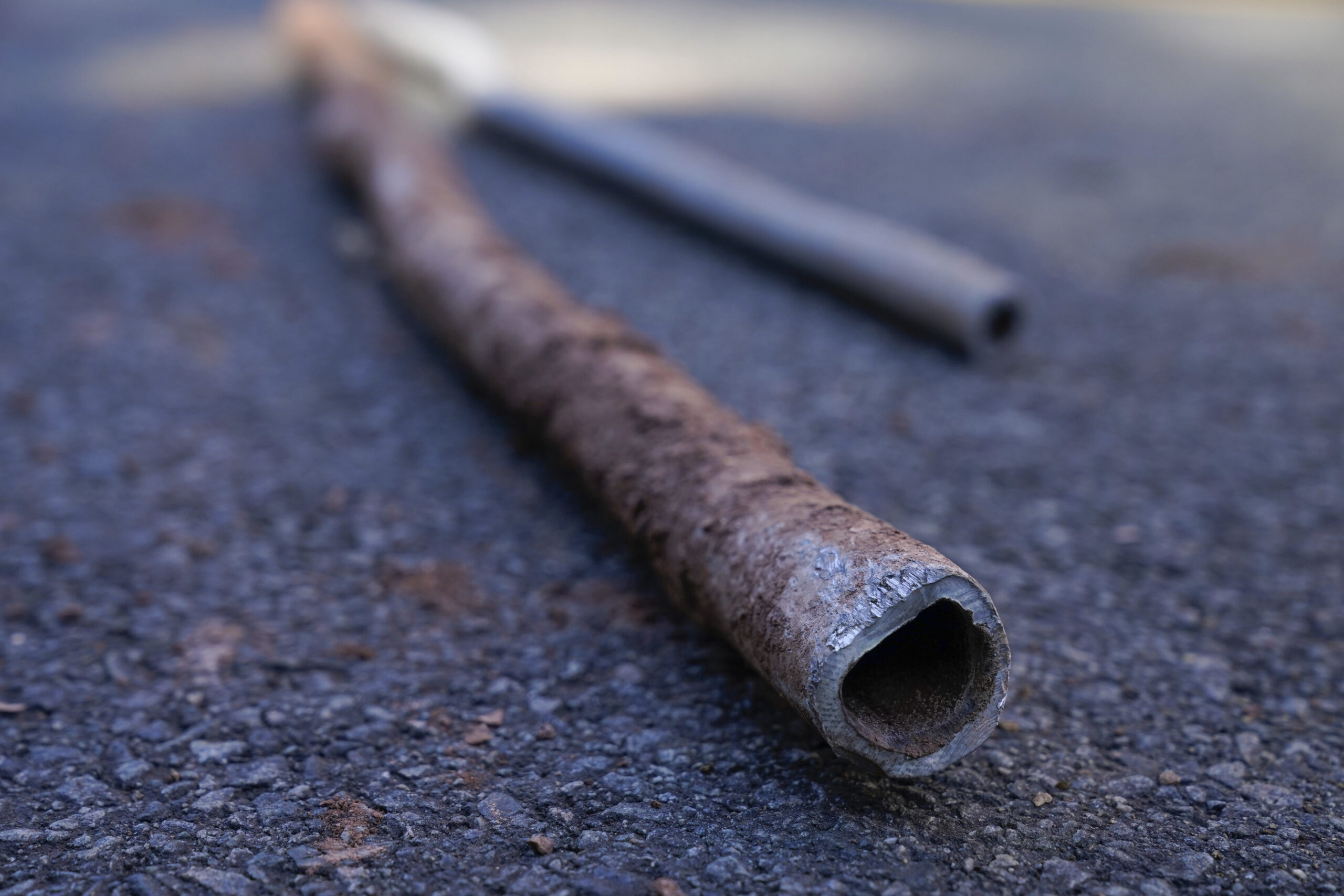 FILE - Lead water pipes pulled from underneath the street are seen in Newark, N.J., Oct. 21, 2021. ...