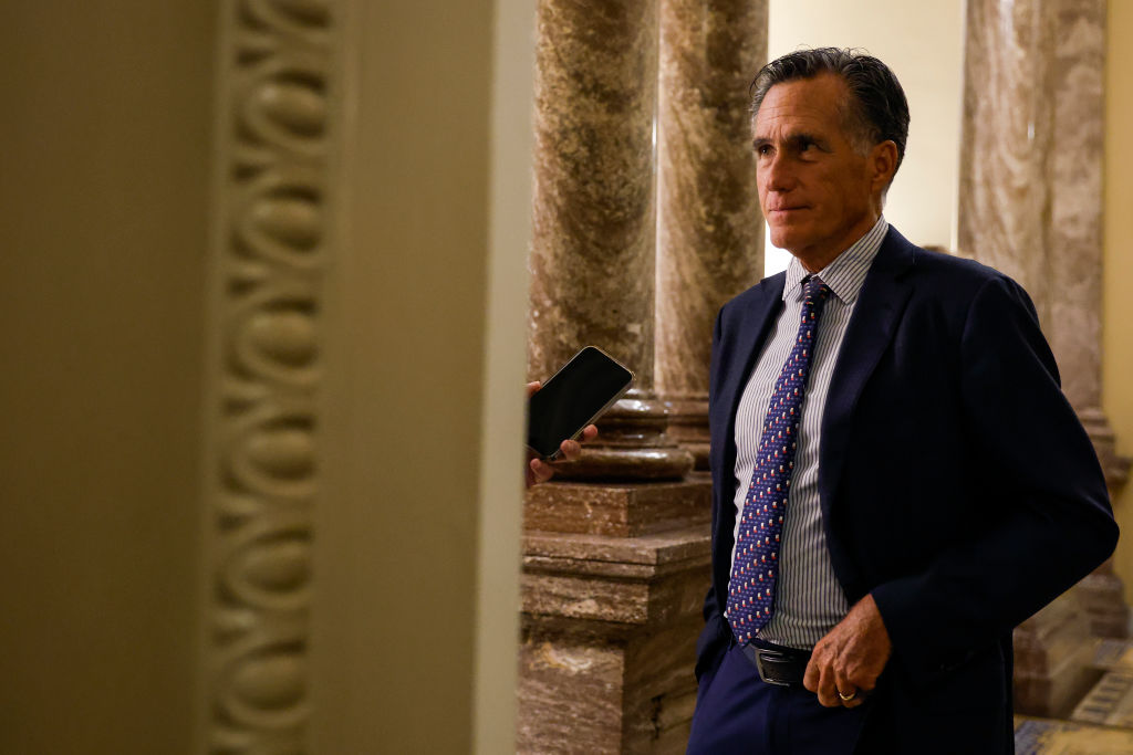 FILE: Sen. Mitt Romney (R-UT) speaks to a reporter during a vote on a continuing resolution to fund...