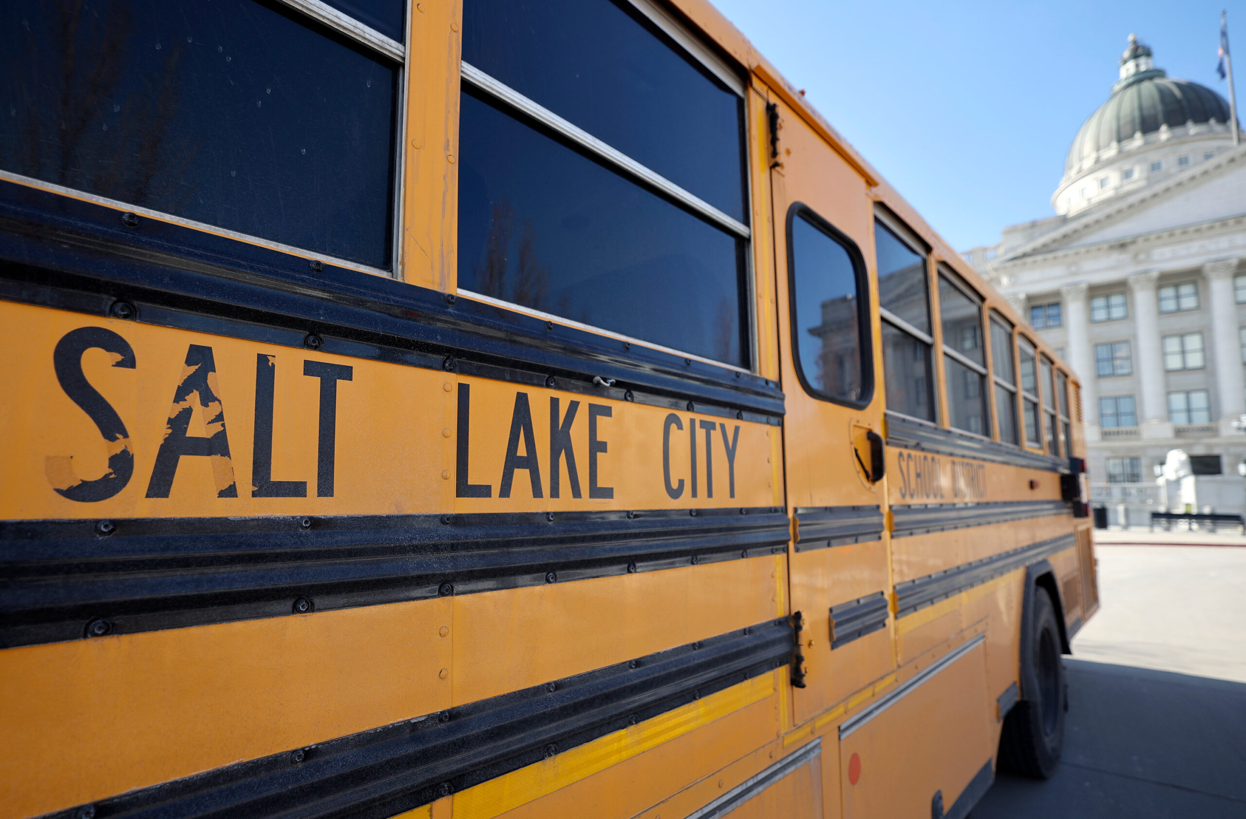 A Salt Lake City School District bus is pictured outside of the Capitol in Salt Lake City, on Tuesd...
