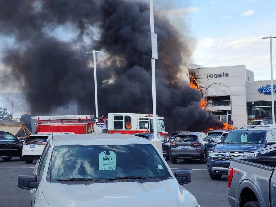 The Tooele auto mall on fire after the semi-truck crashed into it. (Courtesy: Jeremey Hall)...