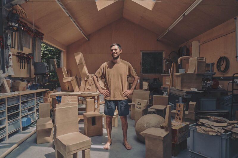 Designer Max Lamb with some of his cardboard furniture. (Tom Jamieson, Courtesy of Gallery FUMI)