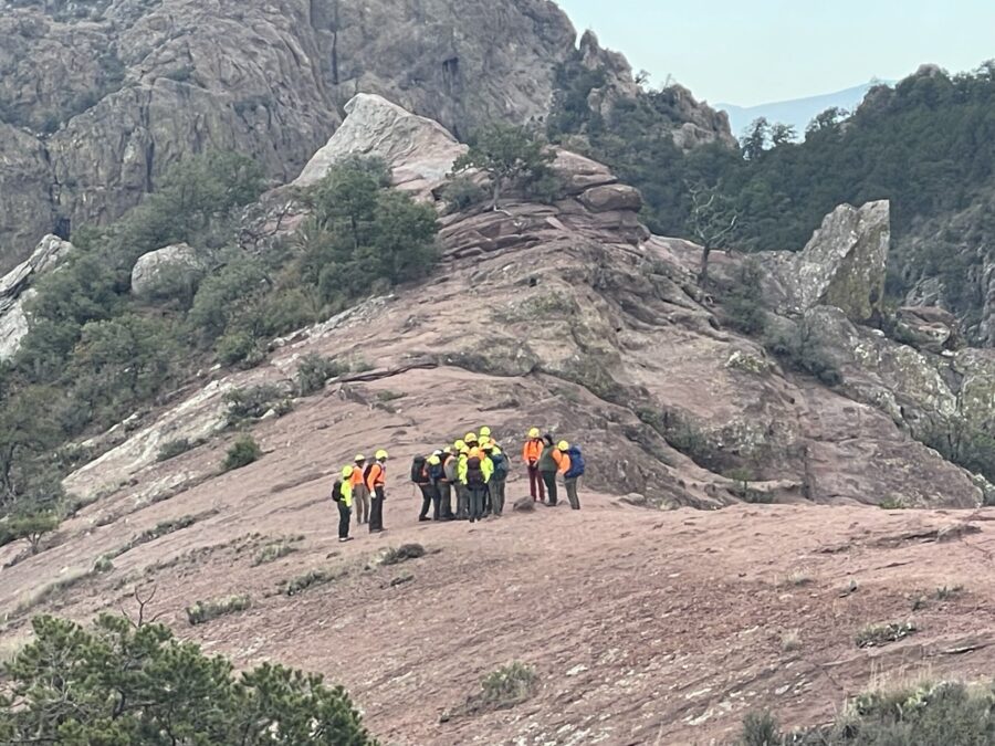 Rescuers are seen transporting the hiker, Christy Perry, near the summit of the Lost Mine Trail on ...