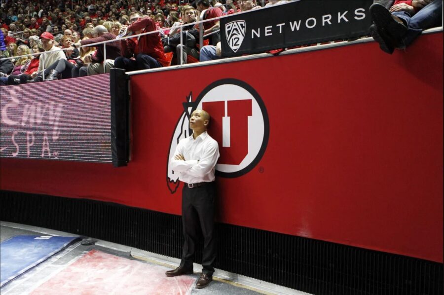 Tom Farden watches the arena screen during an NCAA gymnastics meet versus the BYU Cougars at the Hu...