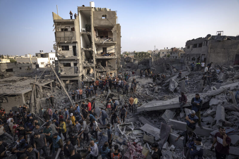 Palestinians look for survivors of the Israeli bombardment in the Maghazi refugee camp in the Gaza Strip, Sunday, Nov. 5, 2023. (Fatima Shbair, Associated Press)