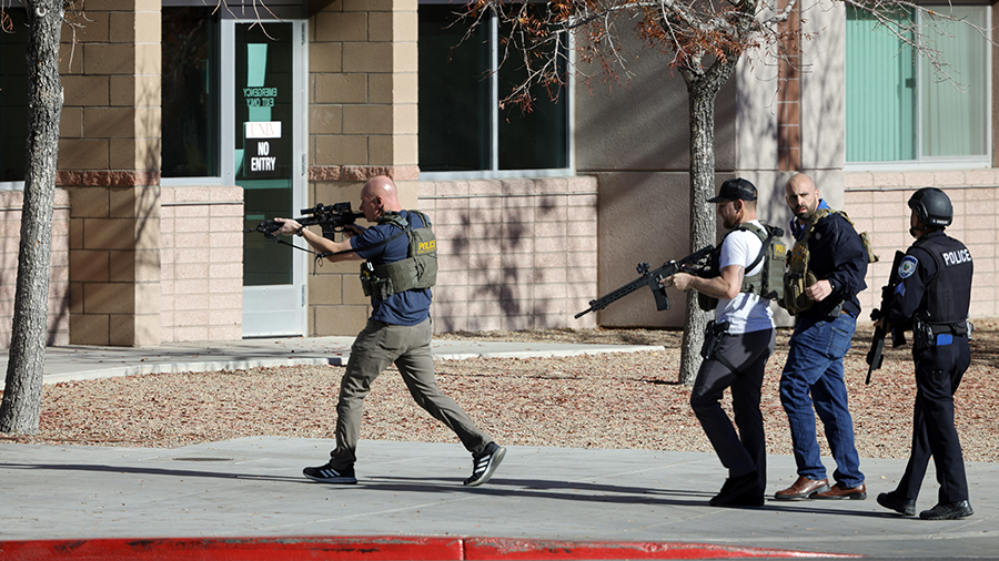 Law enforcement officers head into the University of Nevada, Las Vegas, campus after reports of an ...